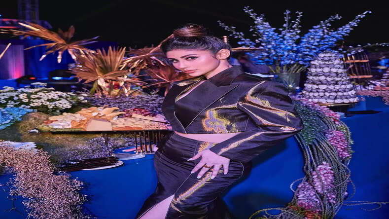  Golden Glamour: Mouni Roy steals the spotlight with her opening act for a brand's launch event in Hyderabad