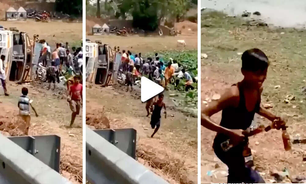 शराब की बोतलों से भरा ट्रक पलटा, शराब लूटने के लिए उमड़ी भीड़, देखिये वीडियो
